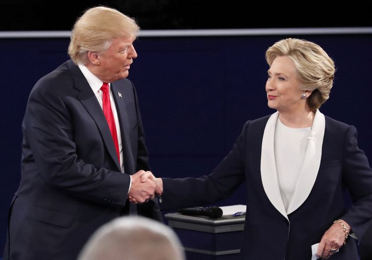 Republican US presidential nominee Donald Trump and Democratic U.S. presidential nominee Hillary Clinton shake hands at the conclusion of their presidential town hall debate at Washington University in St. Louis, Missouri, US, October 9, 2016