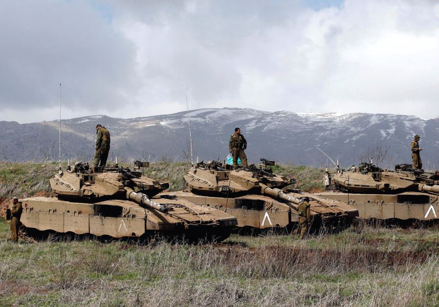 IDF tanks are seen along the Golan Heights border with Syria