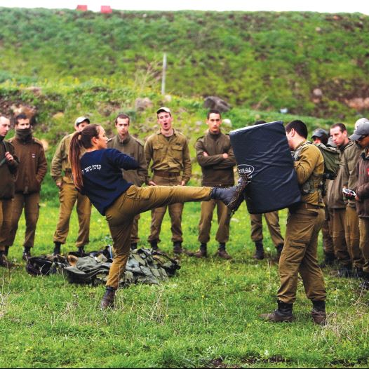 A FEMALE officer demonstrates a move a during a training session in Krav Maga, an Israeli self-defense technique, at a military base on the Golan Heights on March 1.