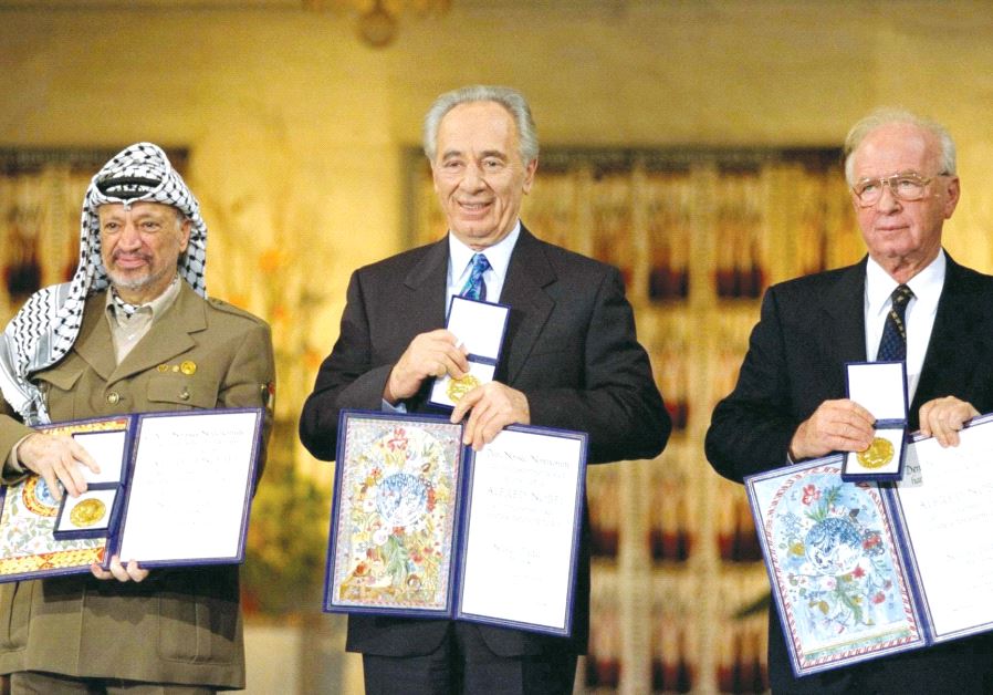 PERES receives the Nobel Peace Prize in Oslo, Norway, in 1994 alongside Yitzhak Rabin and Yasser Arafat.