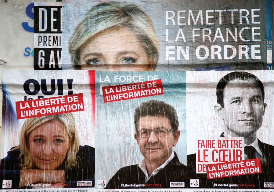 CAMPAIGN POSTERS for candidates Marine Le Pen of the National Front (FN), Jean-Luc Melenchon of the Parti de Gauche, and Benoit Hamon of the Socialist Party who were running in the 2017 French presidential election