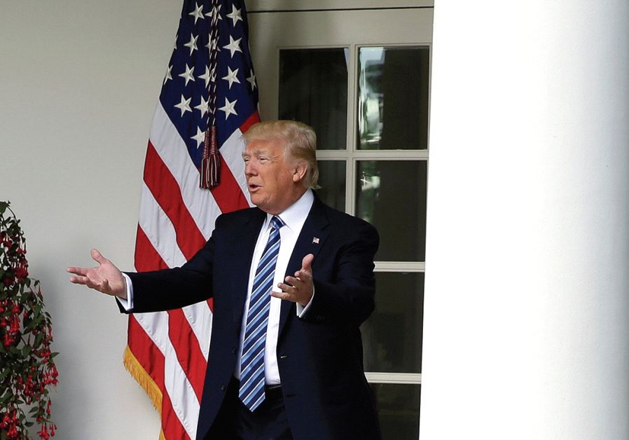 US PRESIDENT Donald Trump gestures to the press