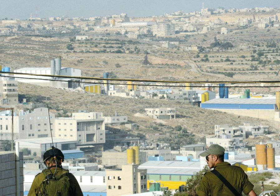 Soldiers overlook the Hebron region in 2014