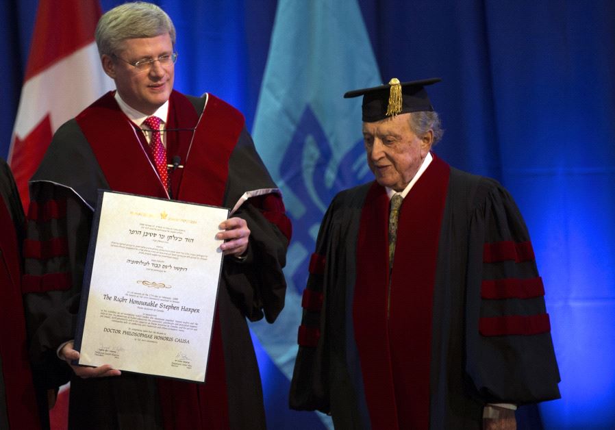 Canada's Prime Minister Stephen Harper stands next to David Azrieli 