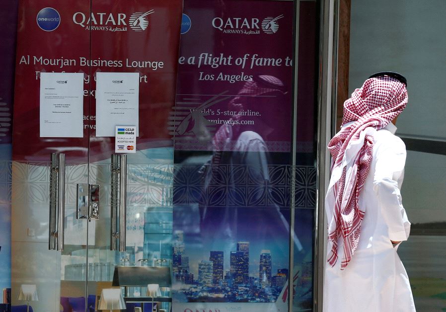A man walks past Qatar Airways office in Riyadh, Saudi Arabia, June 5, 2017