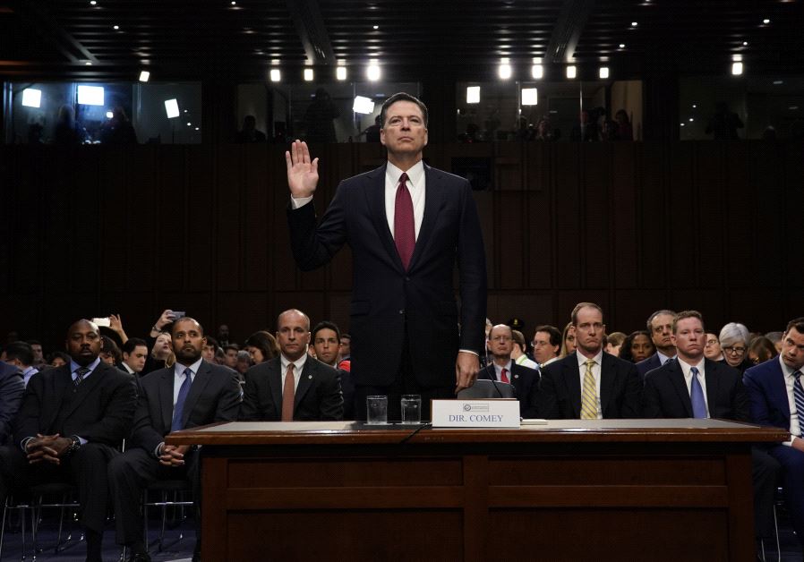 Former FBI Director James Comey is sworn in prior to testifying before a Senate Intelligence Committee hearing on Russia's alleged interference in the 2016 U.S. presidential election on Capitol Hill in Washington, US, June 8, 2017