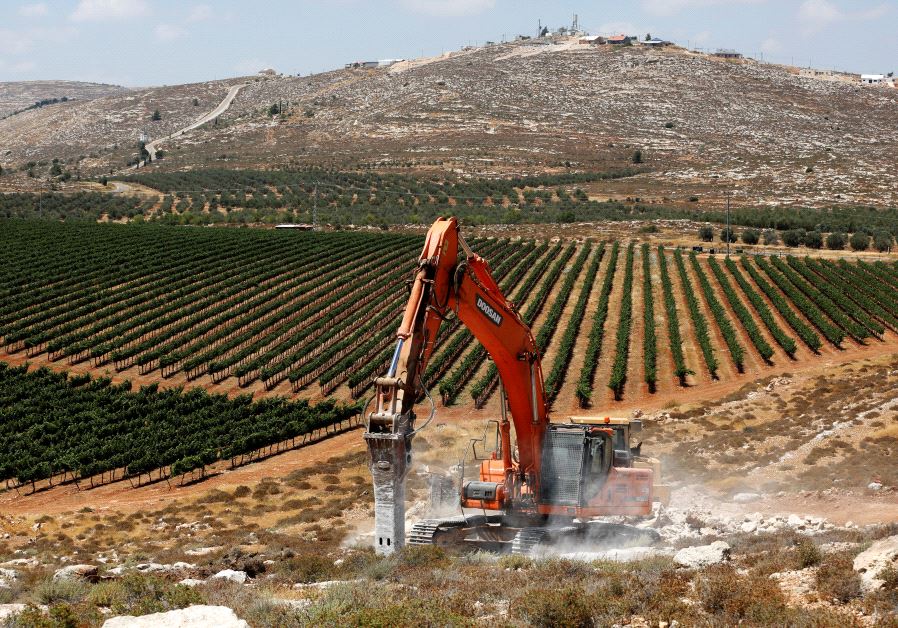 Heavy machinery work on a field as they begin construction work of Amichai, a new settlement which will house some 300 Jewish settlers evicted in February from the illegal West Bank settlement of Amona, in the West Bank June 20, 2017.