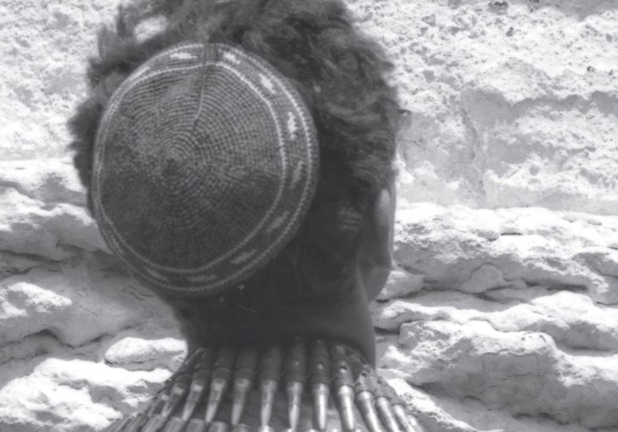 A soldier at the Western Wall during the Six Day War