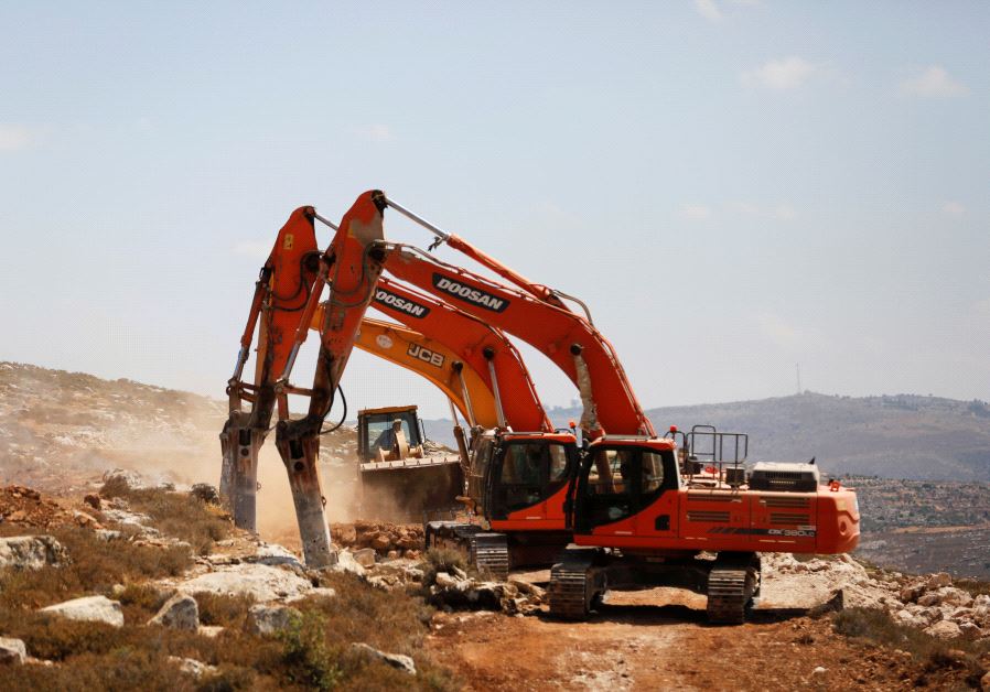 Heavy machinery work on a field as they begin construction work of Amichai, a new settlement which will house some 300 Jewish settlers evicted in February from the settlement of Amona, in the West Bank June 20, 2017.