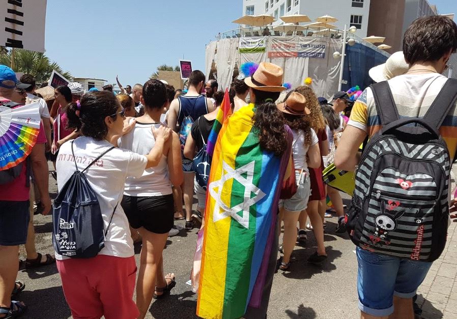Participant with Jewish Pride flag walking in the 2017 Tel Aviv Pride Parade